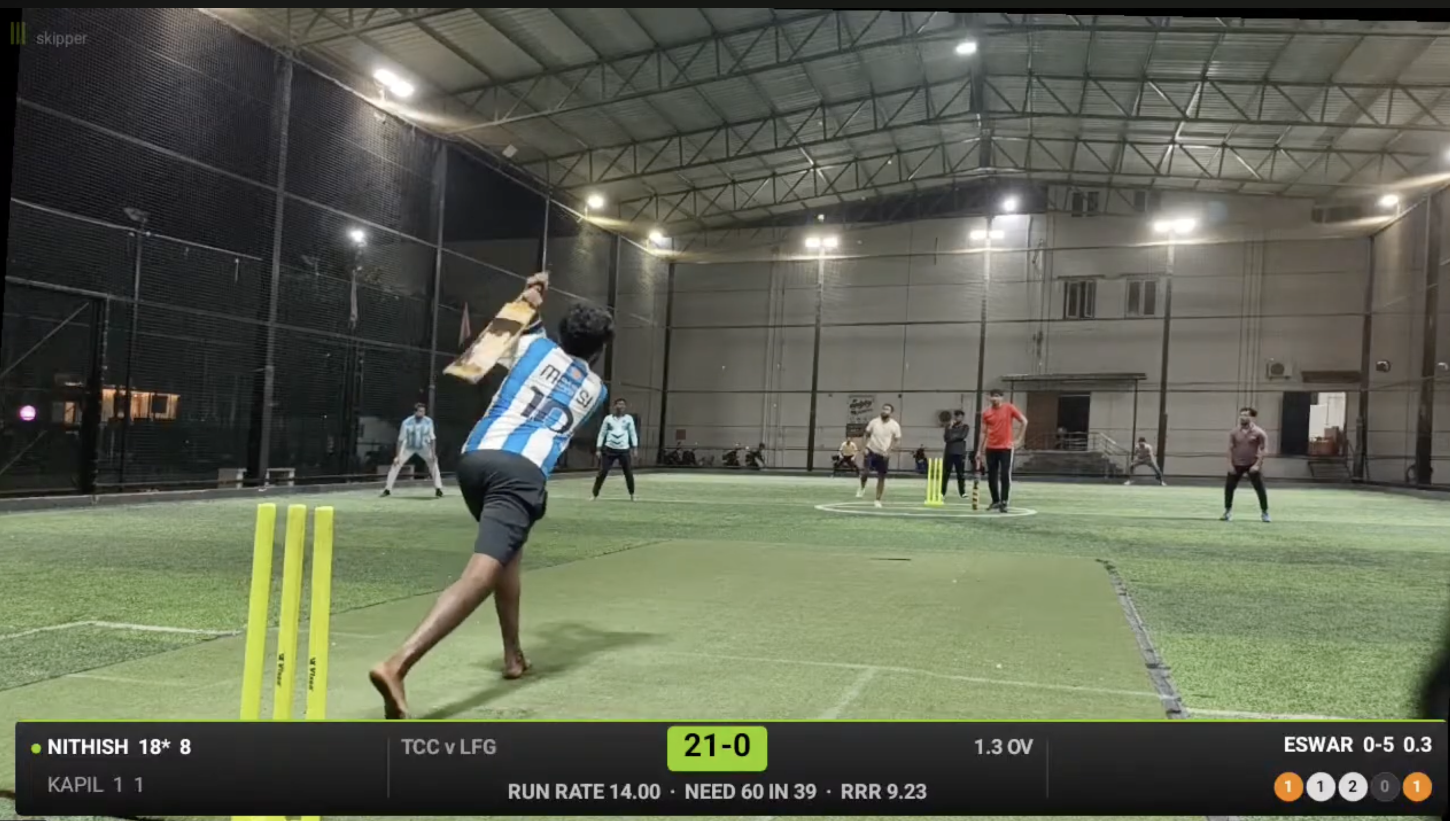 A late-night box cricket match under floodlights in Tiruppur